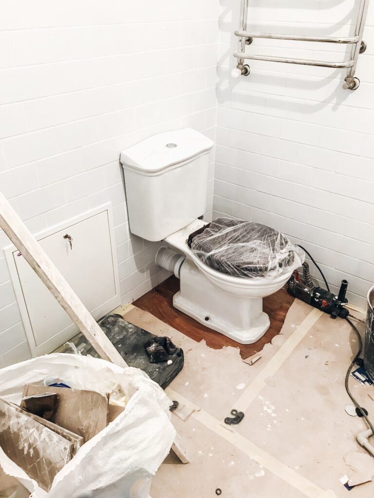 toilet wrapped with plastic during waterproofing